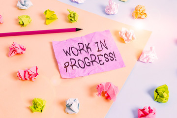 Writing note showing Work In Progress. Business concept for unfinished project that still added to...