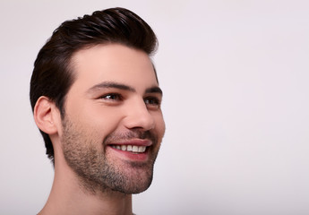 Obraz premium A close-up, a portrait of a smiling happy young Caucasian.