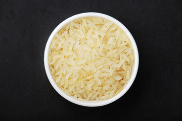 A glass bowl with white long-grain rice	