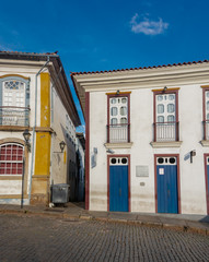 Colorful colonial style buildings with baroque portuguese influence in Ouro Preto, Brazil. Ouro Preto was designed a World Heritage Site by UNESCO in 1980