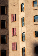 Fototapeta premium Retro Architecture with Red Windows - Vacant Building