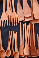 Hand carved wooden culinary spoons/forks and spatulas on display