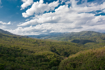 Green hills and blue sky with clouds. Background imagen of nature.