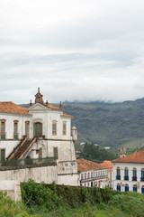 OURO PRETO, MINAS GERAIS, BRAZIL - DECEMBER 23, 2019:  Vertical landscape of astronomical observatory  "Escola de Minas" with mountain in the background in Ouro Preto, Minas Gerais, Brazil