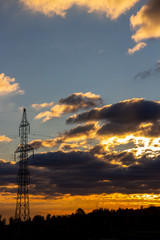 October landscape with beautiful sunset sky and transmission tower