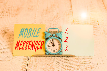 Conceptual hand writing showing Mobile Messenger. Concept meaning mobile tool that allows users to...