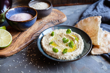 Delicious eggplant dip Baba Ganoush topped with sesame seeds and olive oil