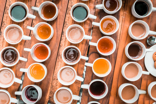 Tasting of different types of coffee and natural teas (ginger, vainilla) on a wooden background in Bali, Indonesia © Diego