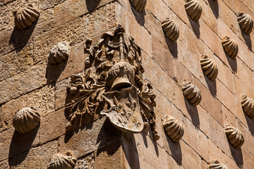 Detail of decorations on the facade of the historical House of the Shells built in 1517 by Rodrigo Arias de Maldonado knight of the Order of Santiago de Compostela in Salamanca, Spain