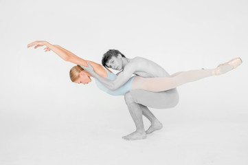 Couple of young and athletic ballet dancers retouched in color and black and white