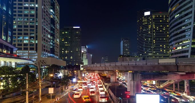 4K timelapes night of bangkok, at skytrain station Chong Nonsi skywalk (BTS) on the Silom Line, Concept of business city.