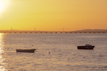 Naklejka premium old fishing boat at sunset
