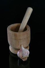 pestle, mortar and garlic bulb