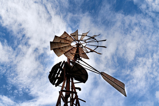post with windmill to draw water