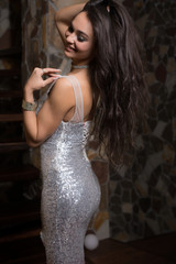 Young beautiful stylish girl in modern interior.