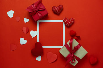 Table top view aerial image of sign valentines day background concept.Flat lay arrangement colorful many heart shape on modern grunge red paper at home office desk studio.Frame for design backdrop.