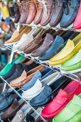 Colorful stand of boat shoes in Capri Italy, near the ferry station for tourists to buy on their way on or off the island for souvenirs. 