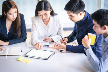 Business team discussing together in conference room during meeting at office. Teamwork, brainstorm and ideas concept. saleperson using tablet and presentation somthing to client.