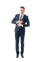 Young businessman suffering from abdominal pain on white background