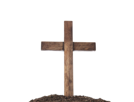 Wooden cemetery cross and soil on white background