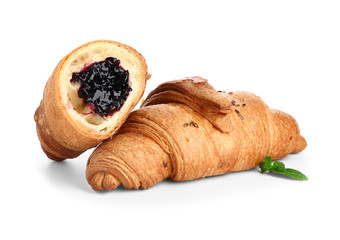 Tasty sweet croissants on white background
