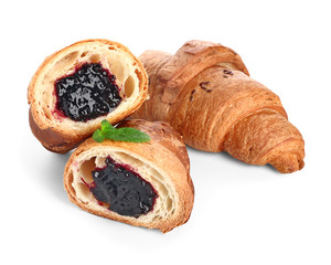 Tasty sweet croissants on white background