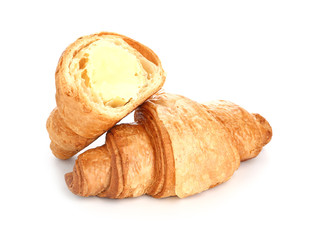 Tasty sweet croissants on white background