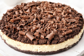Tasty chocolate cheesecake on table, closeup