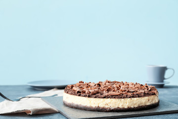 Tasty chocolate cheesecake on table