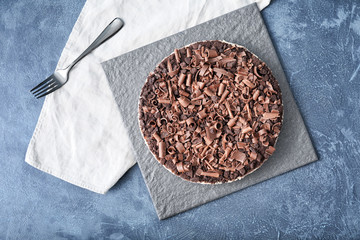 Tasty chocolate cheesecake on dark background