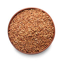 Naklejka premium Bowl with raw buckwheat on white background