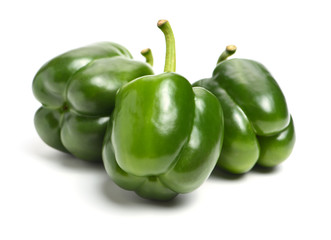 fresh green bell pepper (capsicum) on a white background