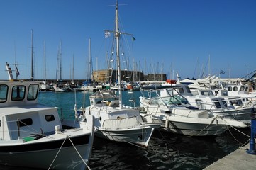 Obraz premium Sailing Boats at the famous ancient sea port of Agios Nikolaos, Crete island, Greece.