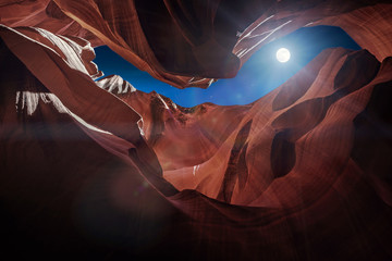 Antelope Canyon's red rock formations under a midnight blue evening sky in Page, Arizona, USA. - Powered by Adobe