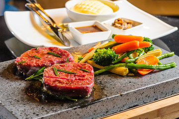 Steak cooked on lava-stone.