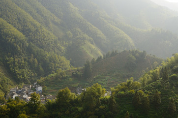 Fototapeta premium Mountain village of Dongchong with tea plantation near Feng Le Lake Huangshan China