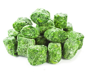 Healthy vegetarian frozen spinach on white background