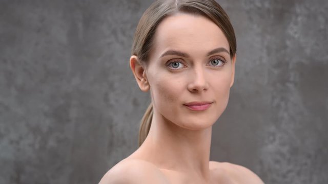 Close-up portrait of seductive smiling girl with natural beauty. Shot with RED camera in 4K