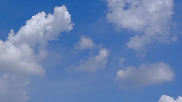 Stock 4k: Time lapse, timelapse video of clear blue sky white fluffy clouds. Royalty high-quality free stock time lapse footage of blue sky and white cloud. Time lapse of natural cloudscape background