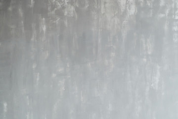concrete wall painted with gray and white paint