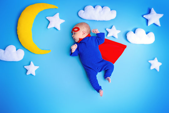 infant in superman costume