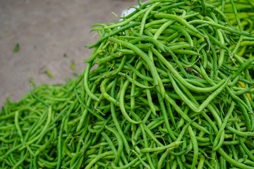 Fresh green beans Bundle, long beans close up, green beans background, Fresh beans in the market, Colorful food ingredient background