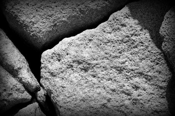 Coastal rock texture close-up. Stone background black and white
