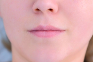 Naklejka premium Woman's lips before permanent makeup microblading procedure, closeup view. Beauty industry concept.