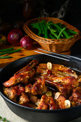 Spicy pork ribs with garlic and barbecue sauce