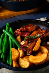 Rib of pork with beans and quarter potato