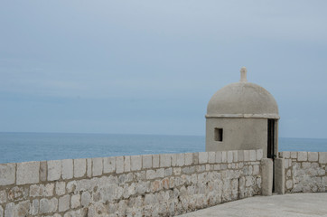 View of the gun turret on Dubrovnik city walls and sea in Croatia