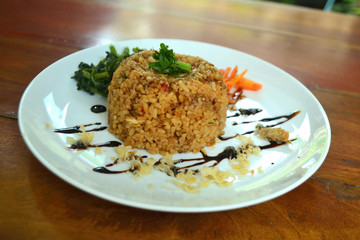 Fried rice with asparagus bean and carrot in a white plate