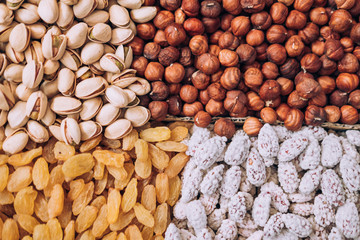 Nuts (pistachios, raisins, almonds, hazelnuts) are located in a rectangular shape.