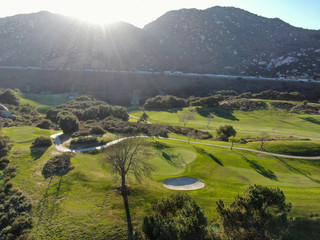 Aerial view of golf course with green field in the valley. Green turf scenery. Temecula, California, USA